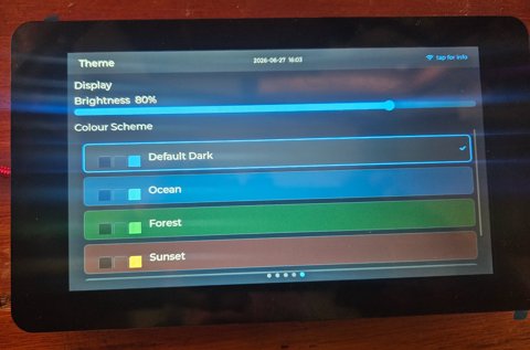 Themes and brightness — Default Dark, Ocean, Forest, Sunset; tune it to the room
